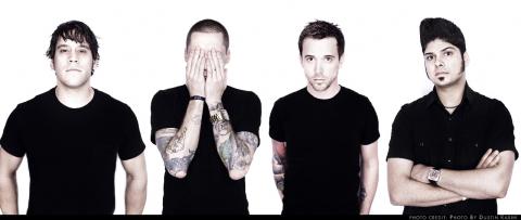 Billy Talent drummer Aaron Solowoniuk (covering face with hands)