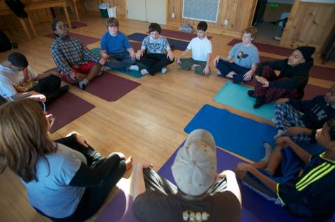 Kids from  Trails Youth Initiatives practice yoga