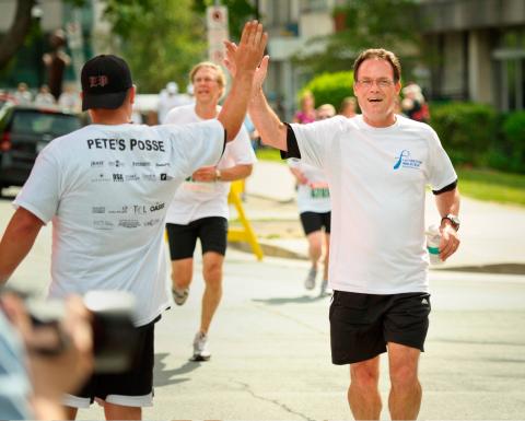 Runners celebrate their achievement at the Father’s Day Walk/Run in Halifax